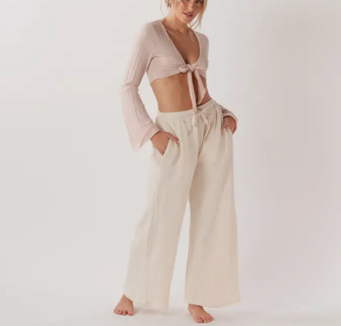 Pantaloni larghi in cotone con tasche.